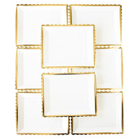 set of white and gold scalloped-edge paper plates arranged in a stylish layout. These 12" square plates are ideal for adding a luxe touch to your Thanksgiving table.