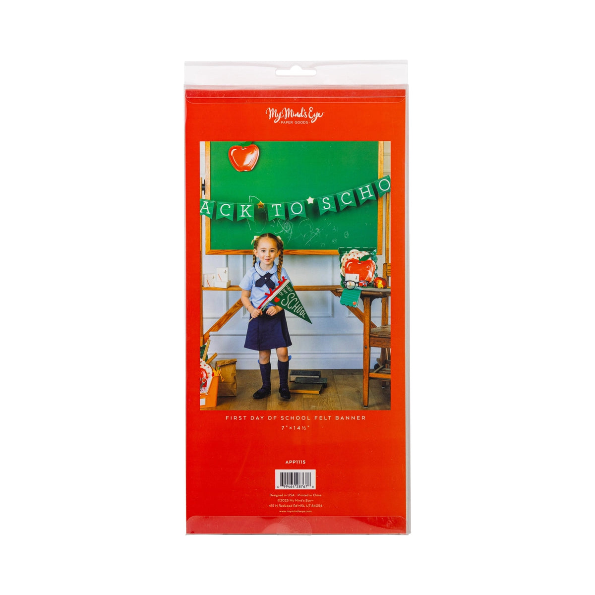 Packaged felt “First Day of School” pennant featuring a child holding the sign in a classroom setup