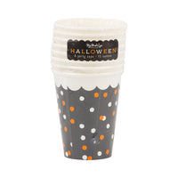 Front view of stacked polka-dot Halloween cups showing scalloped rim and retail sleeve.
