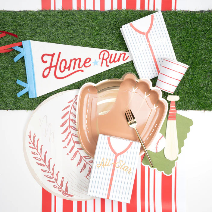 Baseball placemat styled with a glove shaped plate, jersey napkins, and a Home Run pennant.