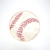 Single round baseball paper placemat with red stitching photographed overhead on white.