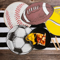 Baseball and tennis ball placemats on a black and white stripe runner with a plate of pizza.