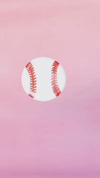 Video of a baseball shaped paper plate be used as a baseball prop for a party.