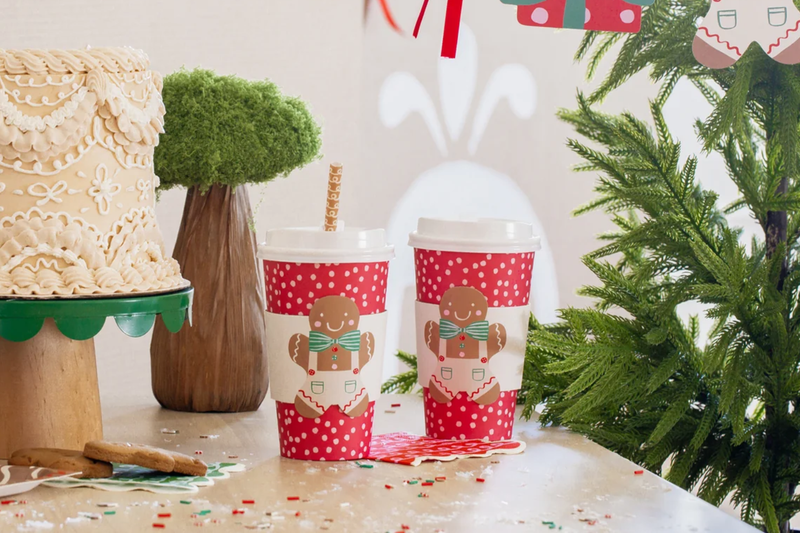 Christmas ornaments and shells on sand