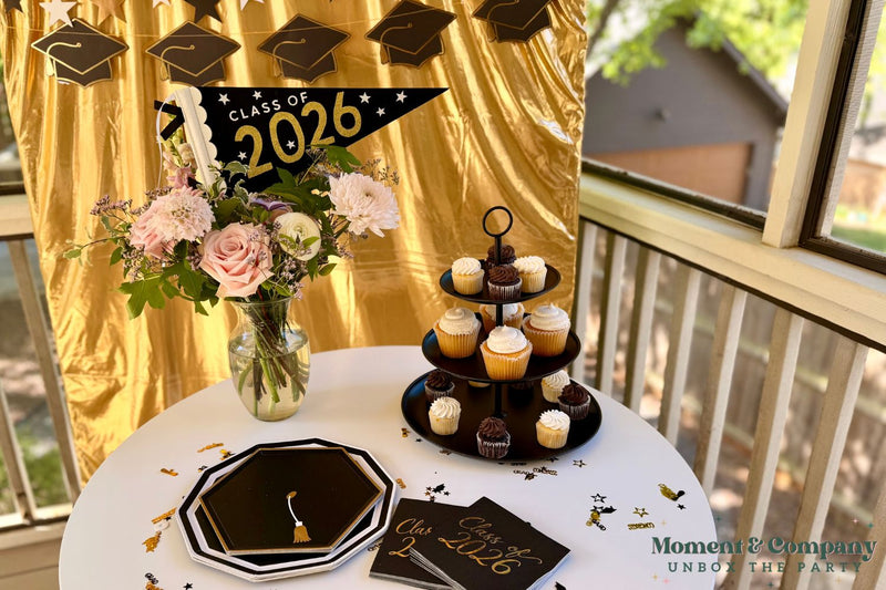  graduation party table decorations with black and gold plates cupcakes and class of 2026 decor