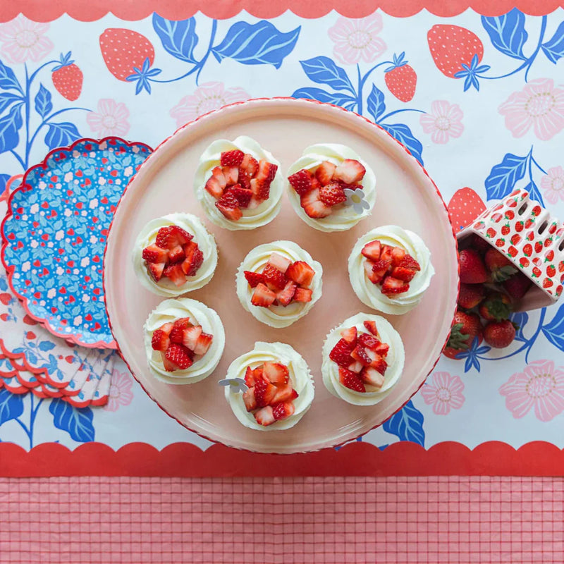 Berry First Birthday party setup with supplies from Moment & Co