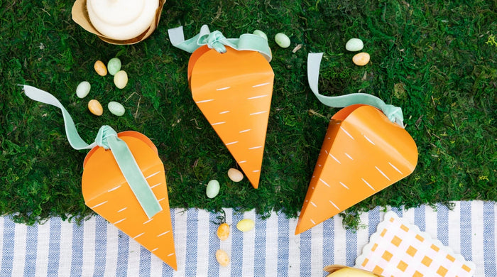 Carrot Patch Easter collection featuring carrot-shaped gift bags and gingham napkins