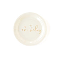 Single white round oh baby plate with gold foil text on a white background