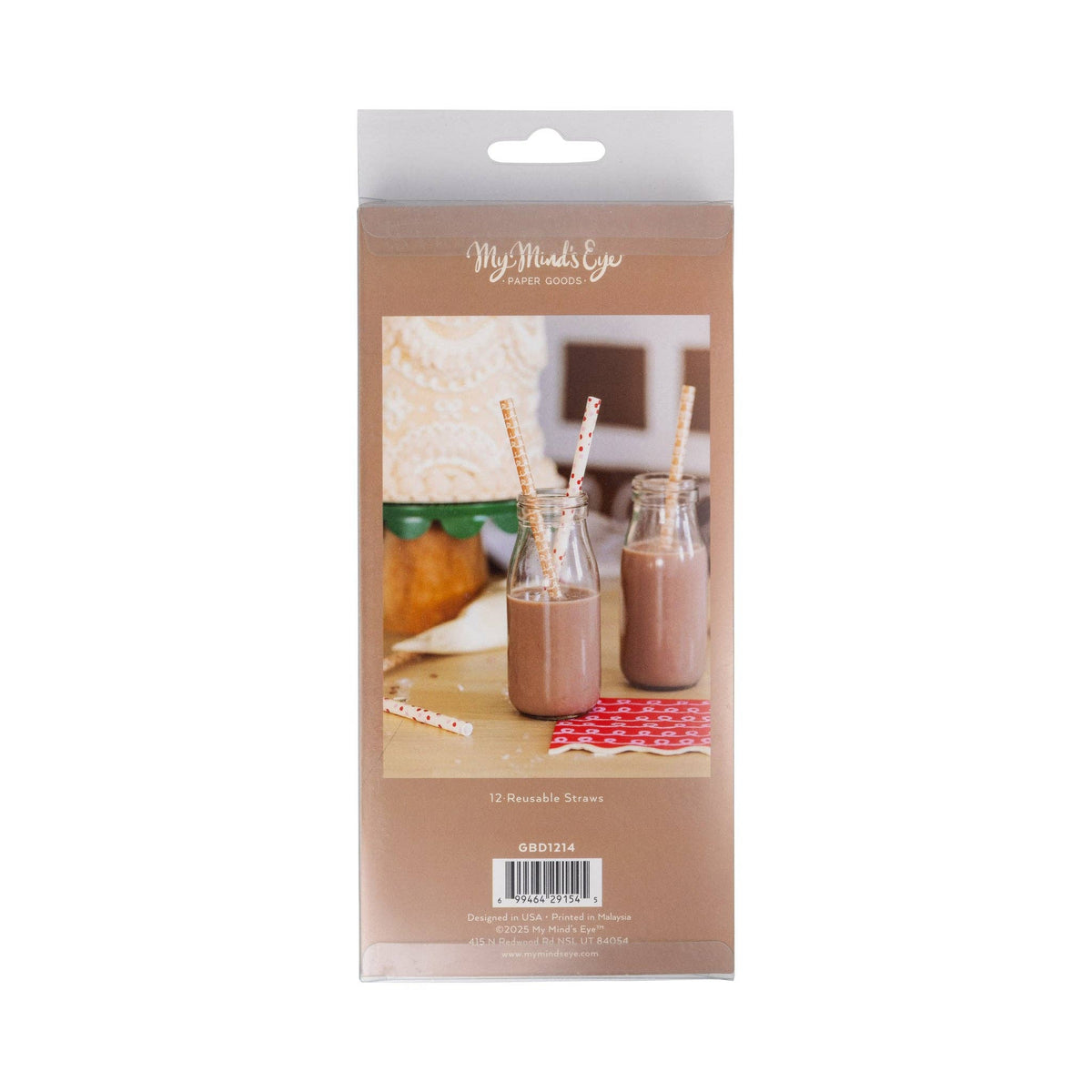 Back of Gingerbread Straws packaging showing straws in bottles of chocolate milk on a decorated holiday table.