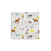 Isolated farm animal napkin showing cows, tractors, horses, and chickens on crisp white.