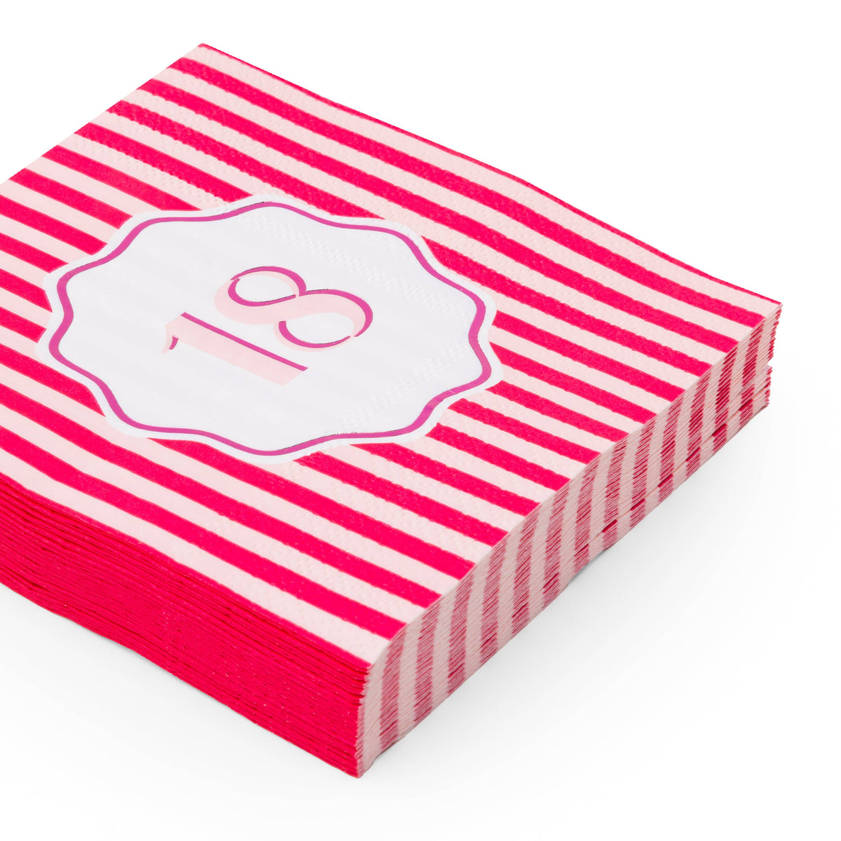 Angled stack of magenta and pink striped 18th birthday cocktail napkins with white scalloped pink foil number 18 badge on white background