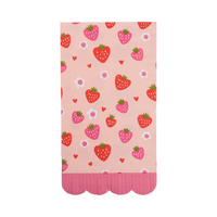 Flat lay of pink scalloped napkin featuring strawberries and flowers