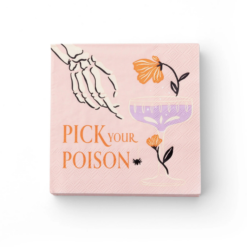 Flat lay of pink cocktail napkin featuring skeleton hand, purple coupe glass, florals, spider, and “Pick Your Poison” text.