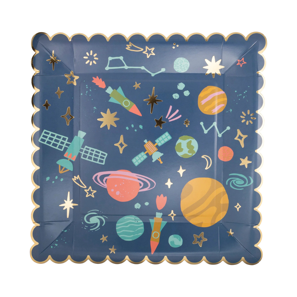 Close-up of gold foil space pattern square plate showing planets and rockets