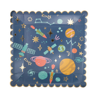 Close-up of gold foil space pattern square plate showing planets and rockets