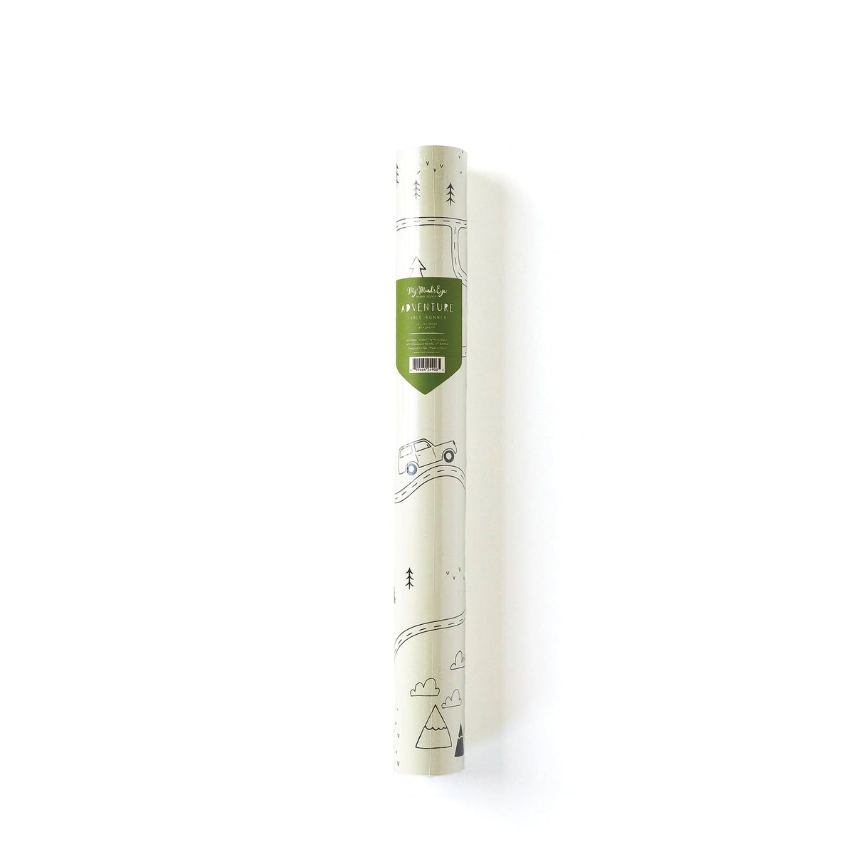 Adventure-themed paper table runner rolled in its packaging, with forest sketch peeking through and a green label showing dimensions and theme.