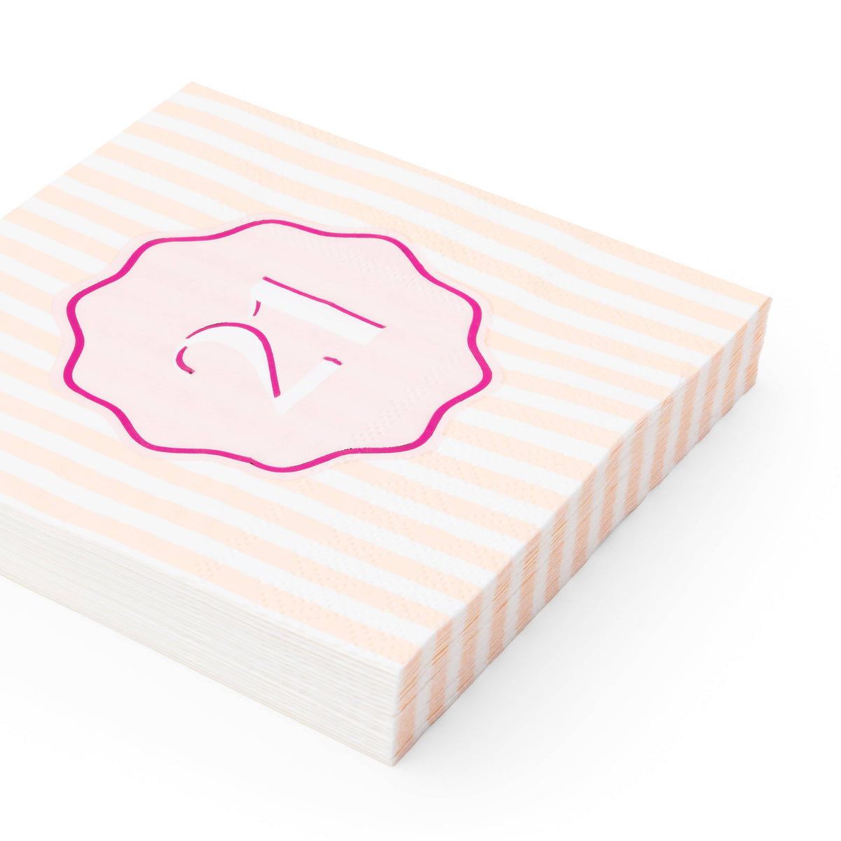 Angled stack of peach and white striped 21st birthday cocktail napkins with pink foil number badge
