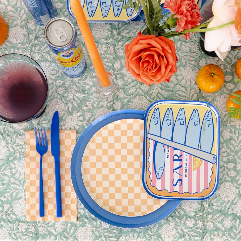 Close-up of Le Dinner Sardine Can Dinner Plate with blue and pink sardine tin illustration.
