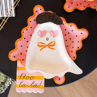 Boo La La napkin under a ghost-shaped plate with coordinating scalloped pink star plate.
