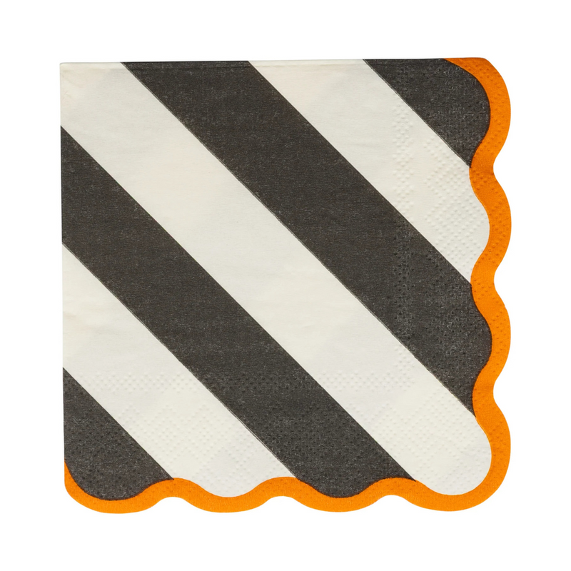 Single black and white striped paper napkin with orange scalloped edges.