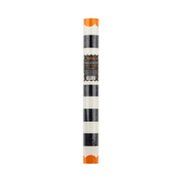 Rolled Orange and Black Striped Paper Table Runner in packaging.