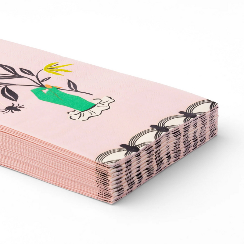 Stack of Floral Halloween Skulls & Spiders guest towels with pink background, green hand illustration, and floral spider design.