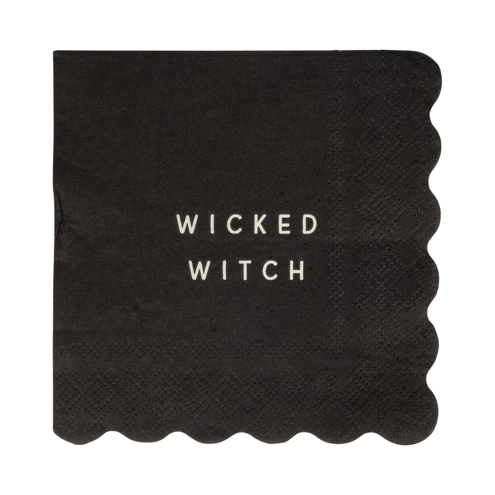 Unwrapped black napkin with “Wicked Witch” in white text