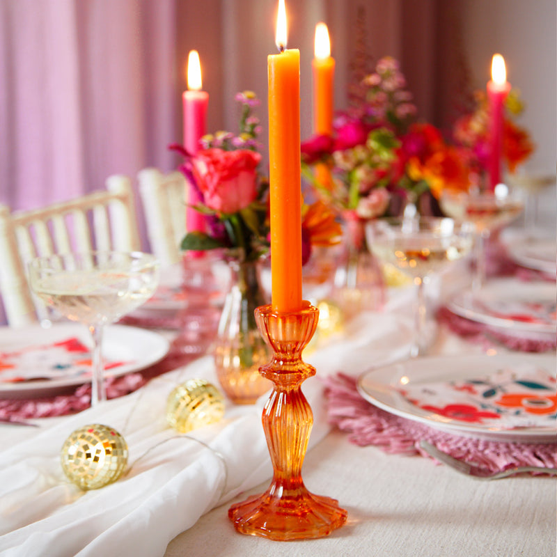Orange glass candle stick holders - perfect for a spring or summer table.