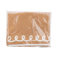 Front view of the Gingerbread Apron – Adult packaged neatly in clear wrap, revealing the gingerbread-inspired print and white trim.