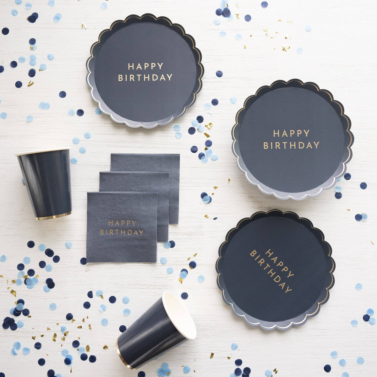 Midnight Blue cups styled with coordinating birthday plates and confetti