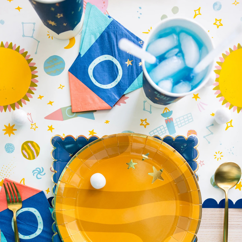 Rocket napkin placed on a colorful space-themed table