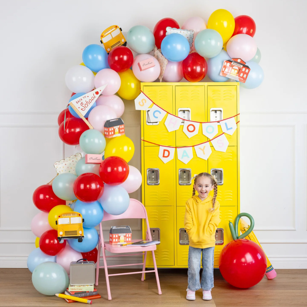 Decorated scene with balloons and child – School Days banner in action