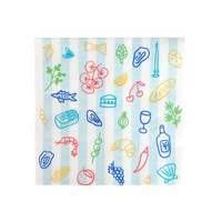 Flat lay of Le Dinner Large Napkins with playful food icons and striped accents.