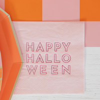 Zoomed-in view of single napkin showing pink background and red “Happy Halloween” text.