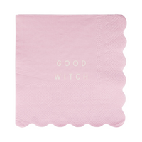 Unwrapped pink napkin with “Good Witch” in white text