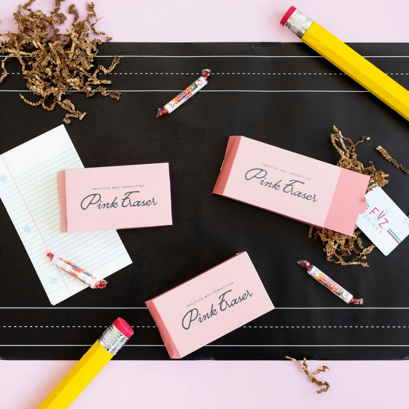 Lifestyle image with pencil eraser favors and notebook paper napkin
