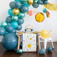 Space paper table runner on kids' party setup with balloons