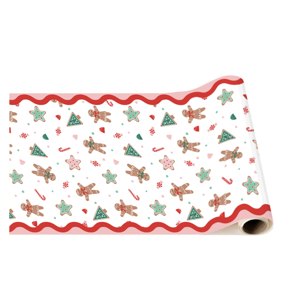 Rolled Sweet Gingerbread Table Runner featuring gingerbread cookies, candy canes, and Christmas tree motifs on white background with red scalloped trim.