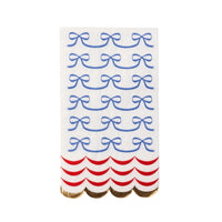 A close-up of a 4th of July guest towel featuring delicate blue bows and a scalloped red border, highlighting the design’s elegant and patriotic details.
