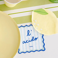 Le Dinner Cocktail Napkin with “l’acido” text in blue and light blue stripes next to lemon napkin.