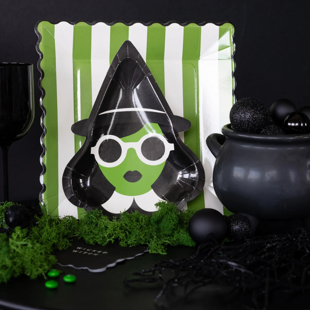 Close-up of green Bad Witch plate on striped background plate