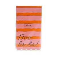 Close-up of a single Boo La La dinner napkin showcasing the pink and orange stripes with scalloped edges.