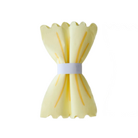 Le Dinner Pasta Noodle Guest Napkin wrapped and folded to resemble fresh pasta on a white background.
