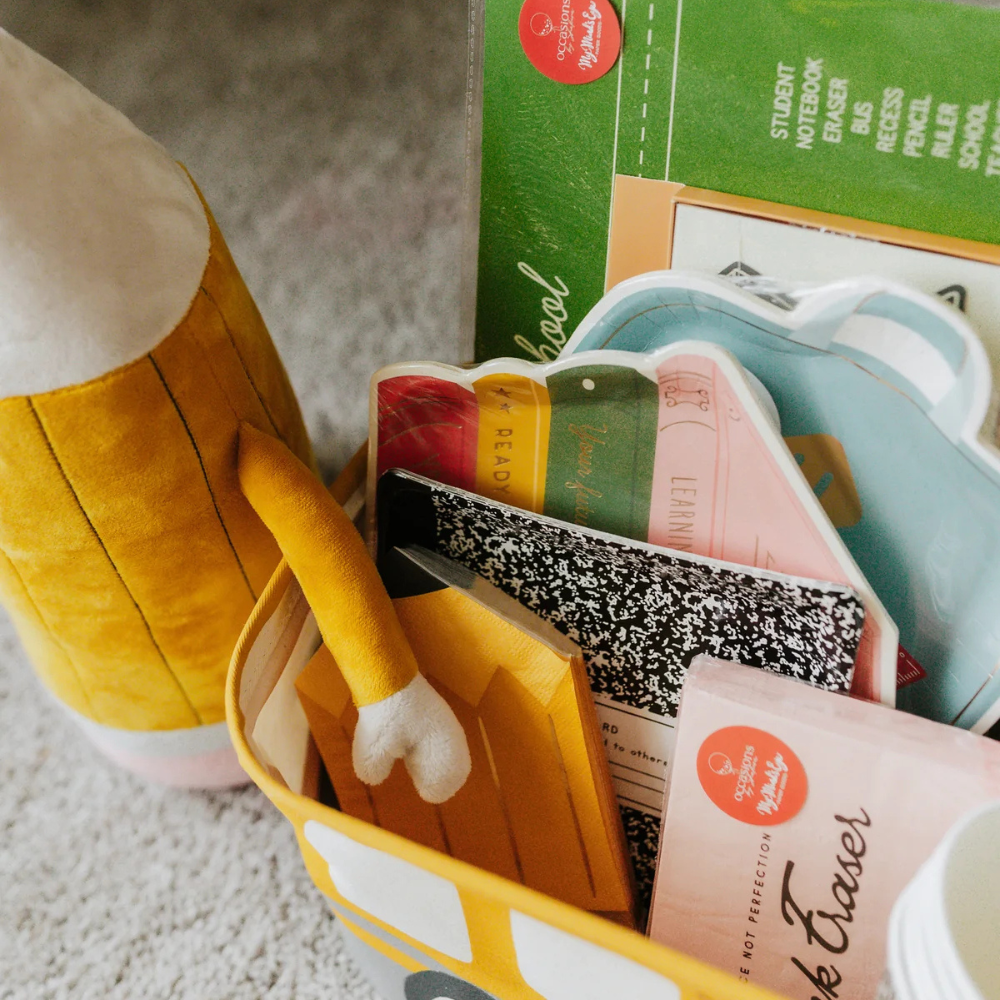 Stack of books plate displayed among back-to-school party items