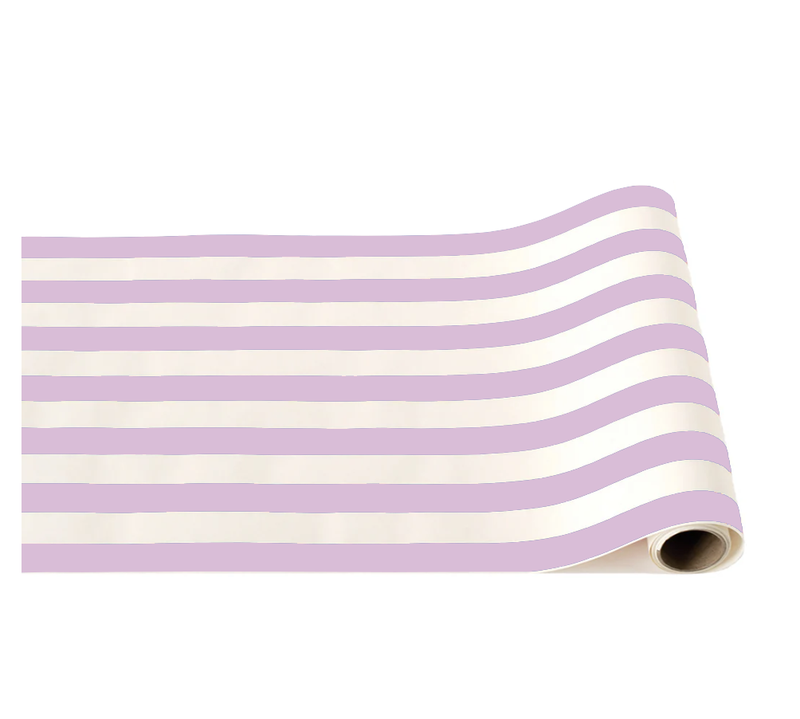 A roll of table runner paper with a simple design of alternating lilac and white horizontal stripes.
