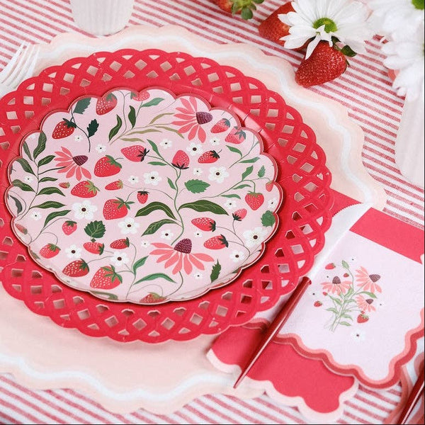 Strawberry Cocktail Napkin paired with red handled utensils and a floral plate for a Pink Garden Party.