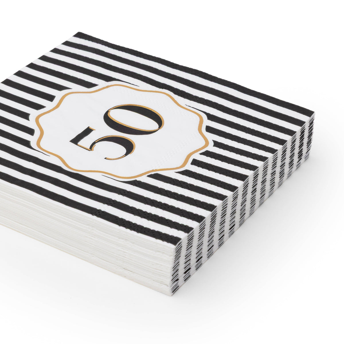 Angled stack of black and white striped 50th birthday cocktail napkins with white gold foil number 50 scalloped medallion on white background