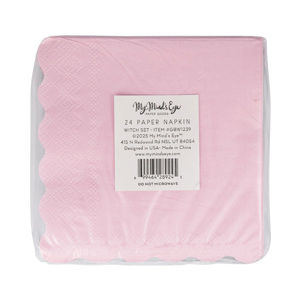 Packaged pink scalloped paper napkins labeled "Good Witch"