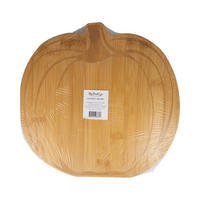 Back of the cutting board showing a jack-o'-lantern face engraved in bamboo.
