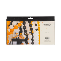 Back of Felt & Bows Happy Halloween Banner packaging showing a decorated party table with balloons and the banner in use.